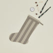Essential Striped Stocking - Light Grey/Dark Grey with candles, and candies.
