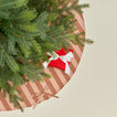 Overhead view of Essential Striped Tree Skirt - Blush/Terracotta with tree
