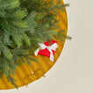 Overhead view of Essential Striped Tree Skirt - Mustard/Bronze with tree