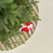 Overhead view of Essential Striped Tree Skirt - Olive/Sage with tree
