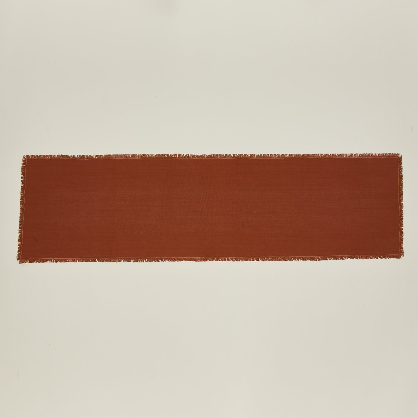 Overhead view of essential terracotta runner