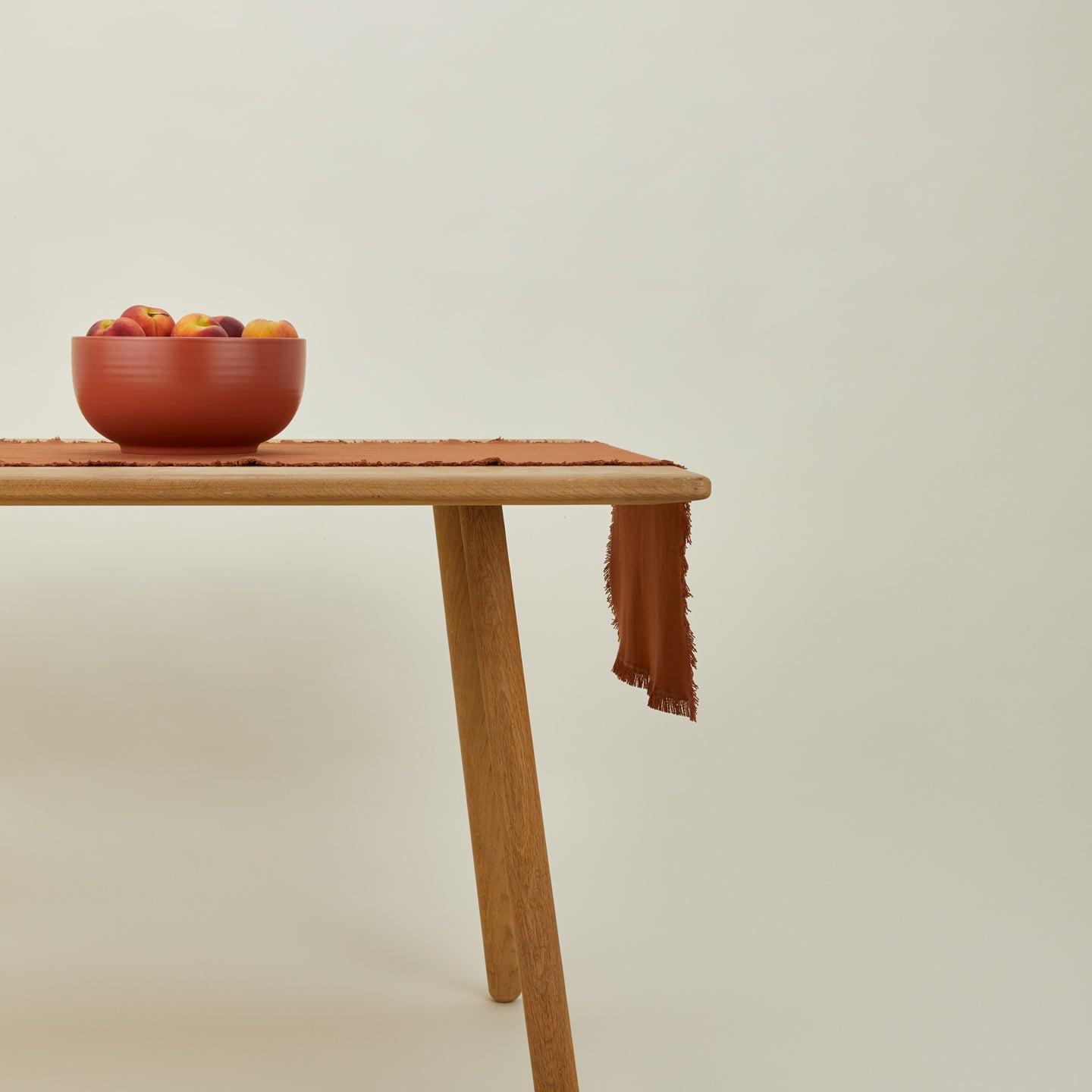Essential terracotta runner on table with serving bowl