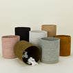 Essential woven wastebasket family in various colors