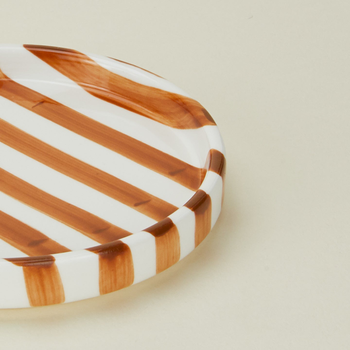 Close up view of Fodory brown striped salad plate