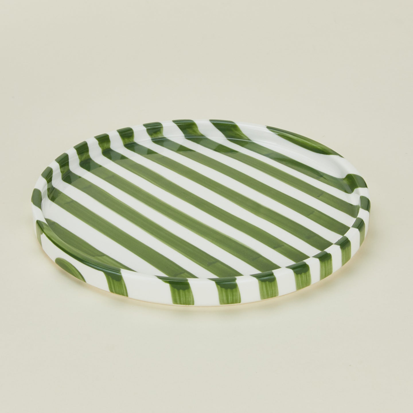 Detailed view of Fodory olive striped  dinner plate