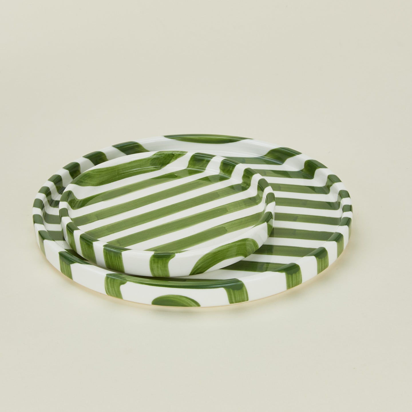 Detailed view of Fodory olive striped plates