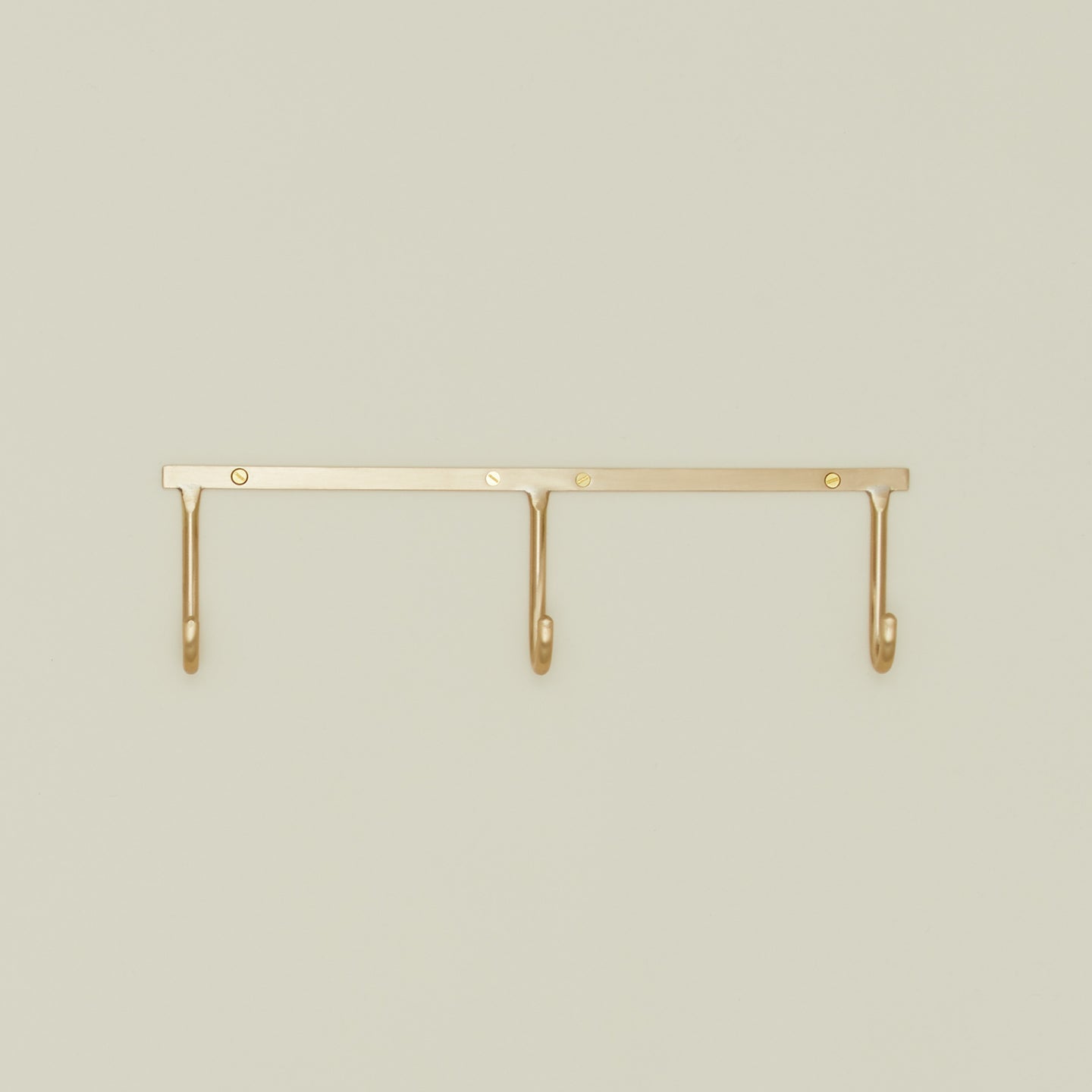 Brass hook rack trio