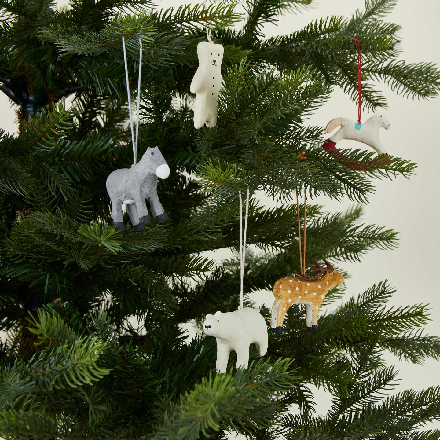 Paper mache ornaments on tree