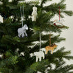 Paper mache ornaments on tree