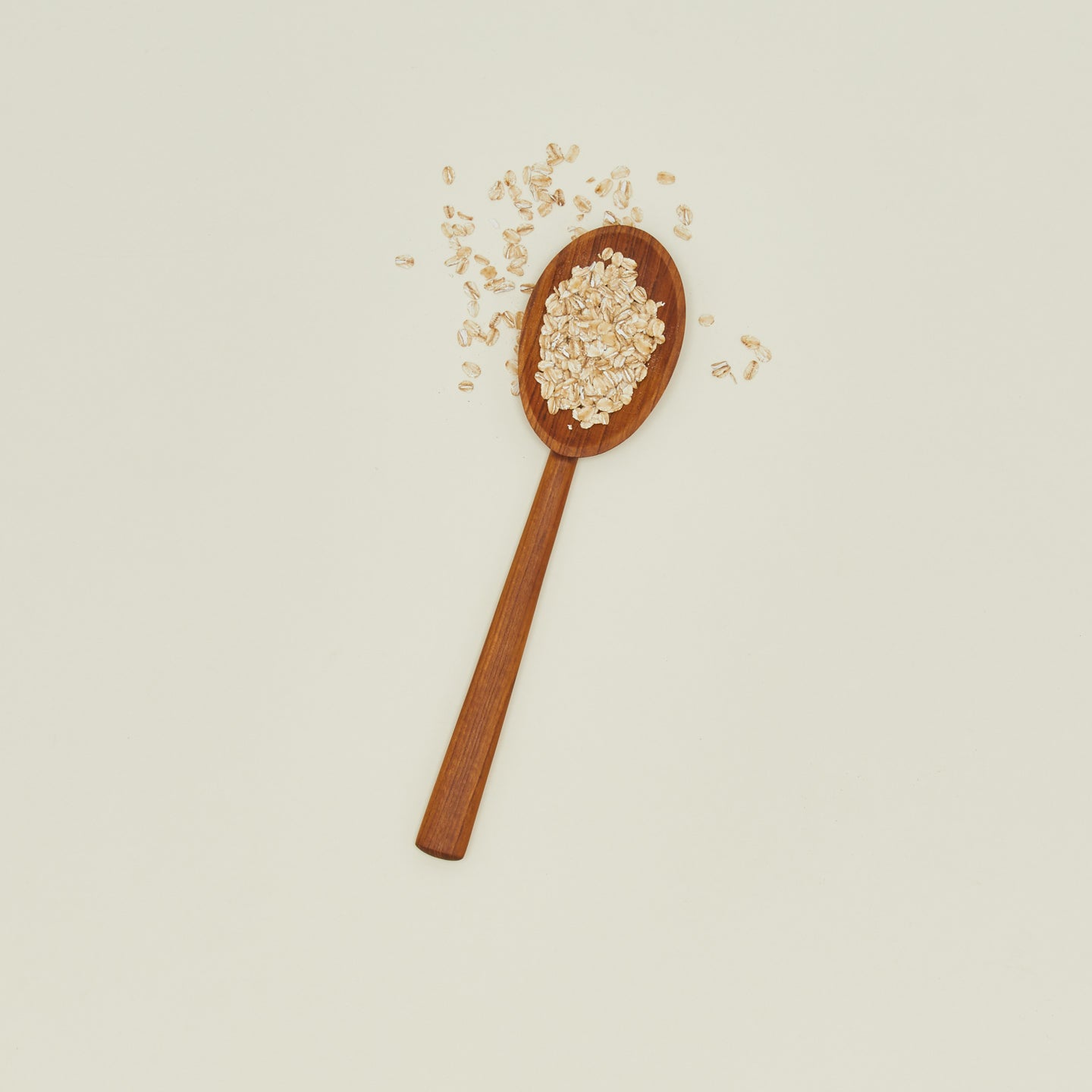 Teak serving spoon with oatmeal