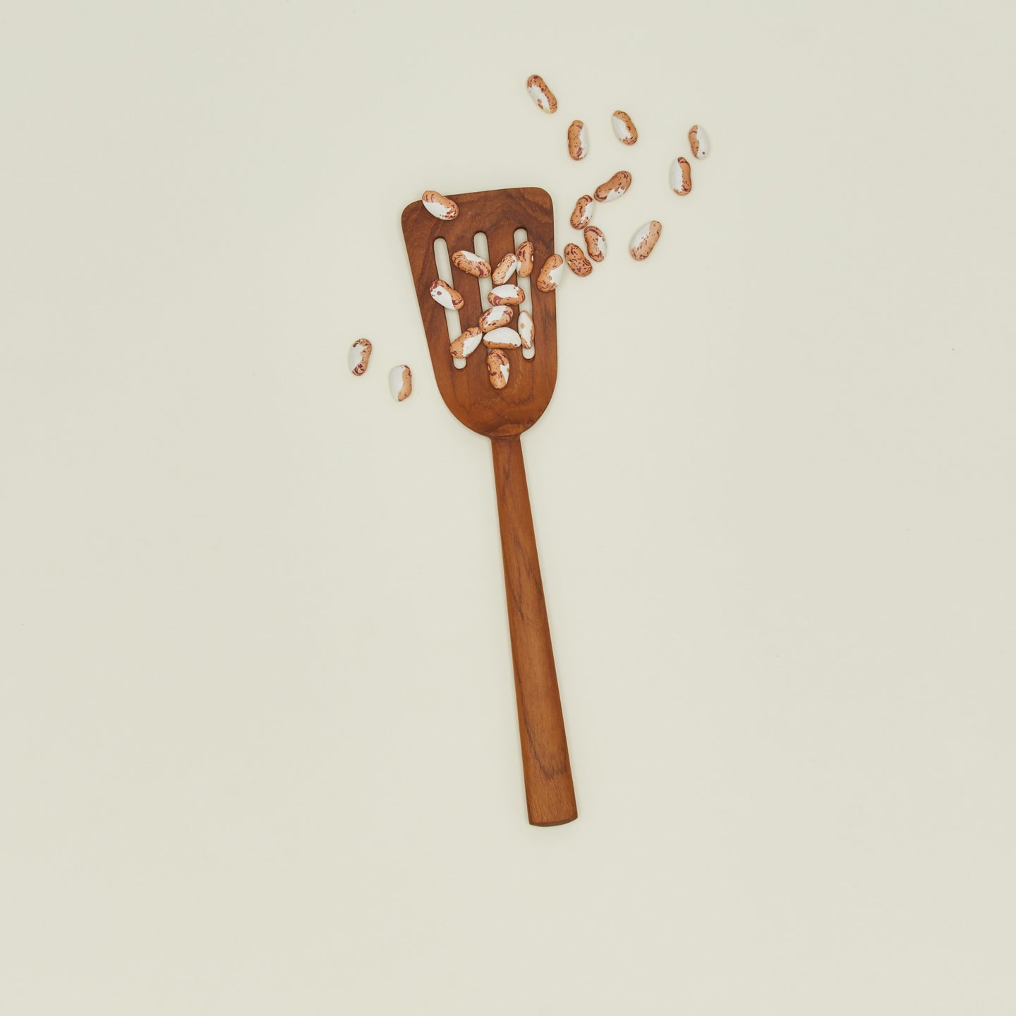Wide Teak Slotted Spatula with beans