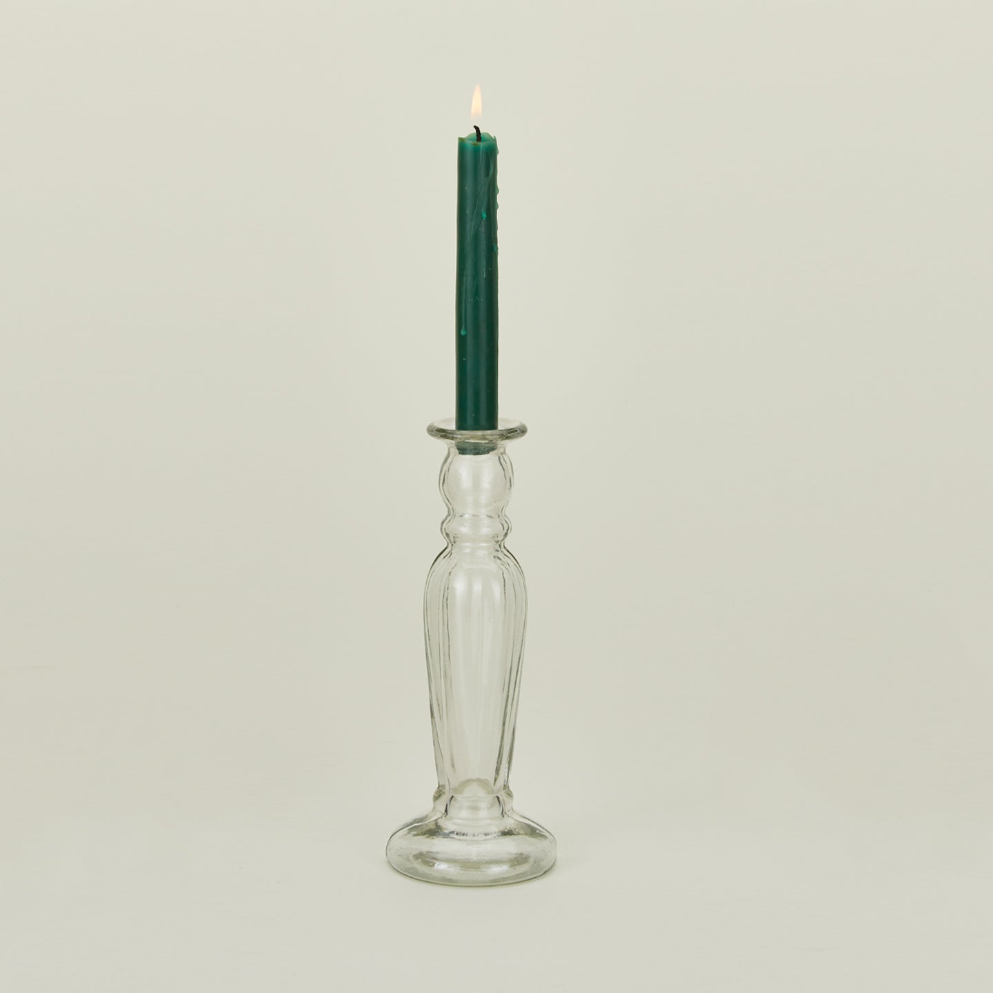 Large blown candlestick holder with candle