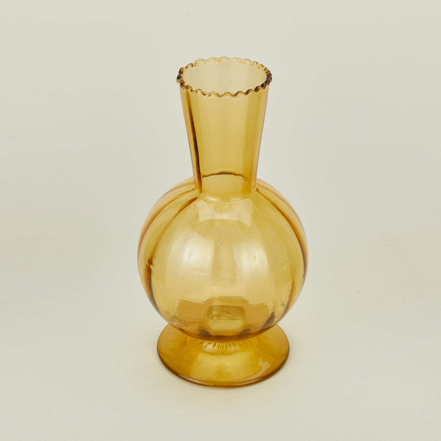 Detailed view of Small amber glass vase