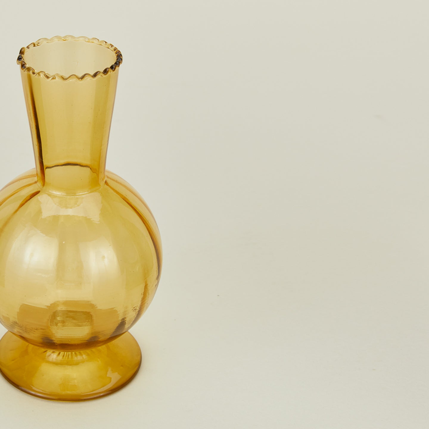 Detailed view of Small amber glass vase