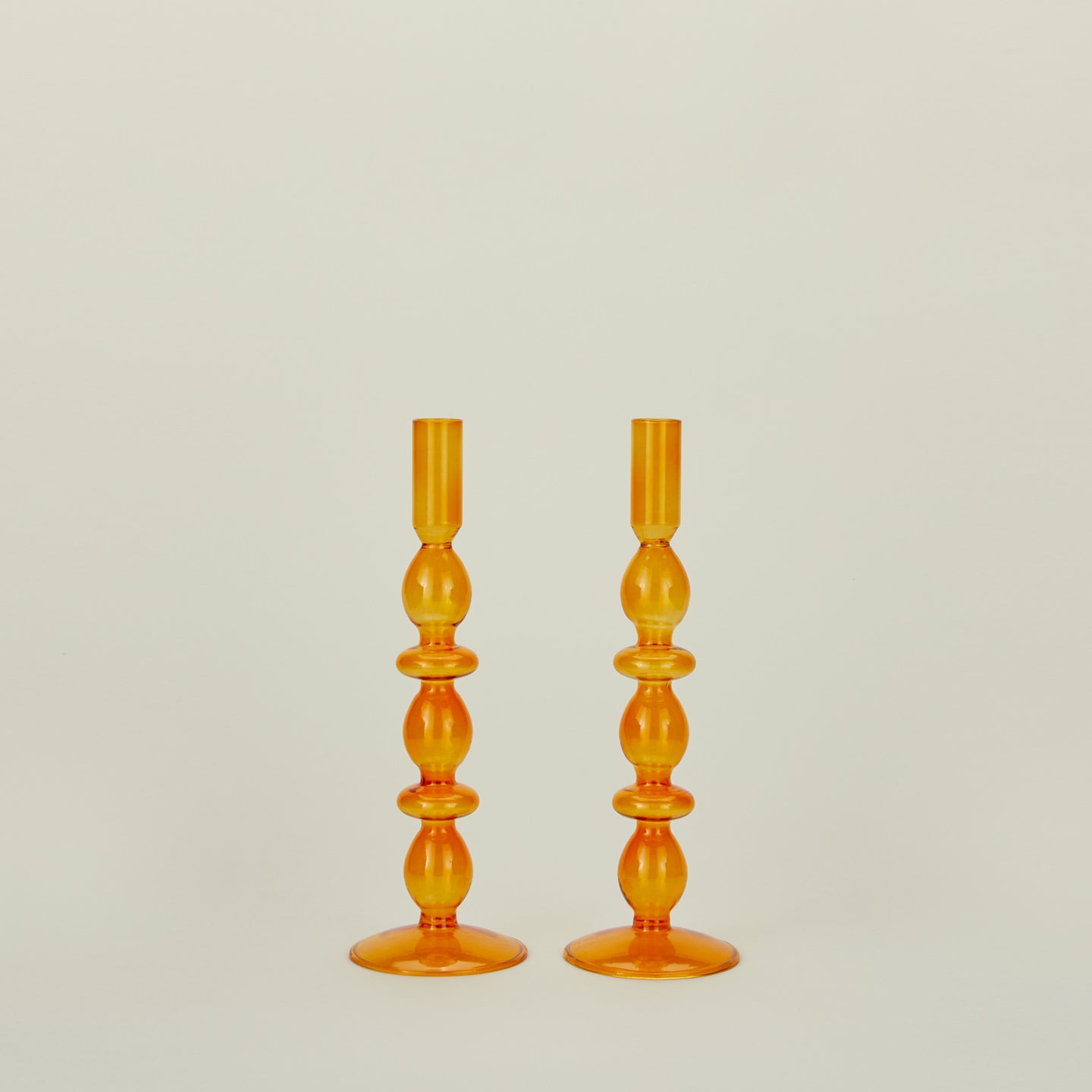 Disk candle holder in amber