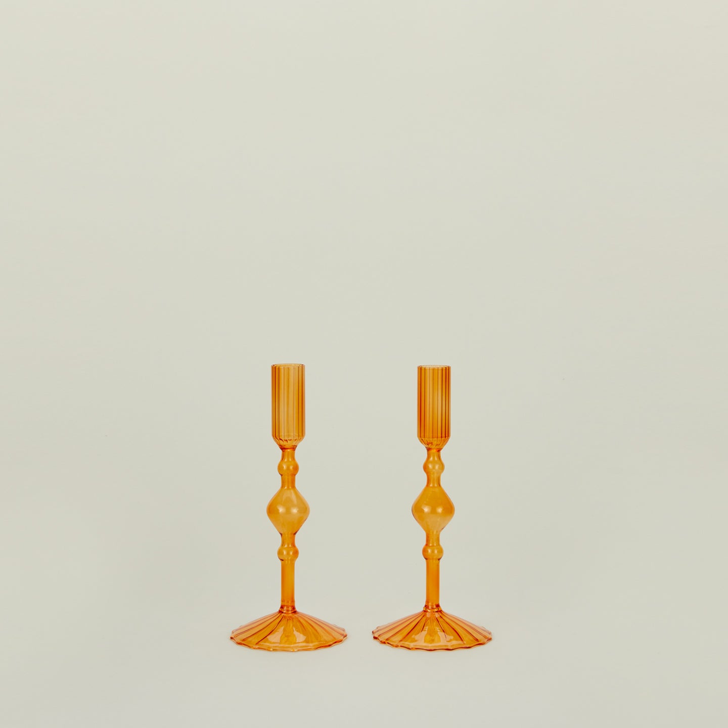 Pleated candle holders in amber