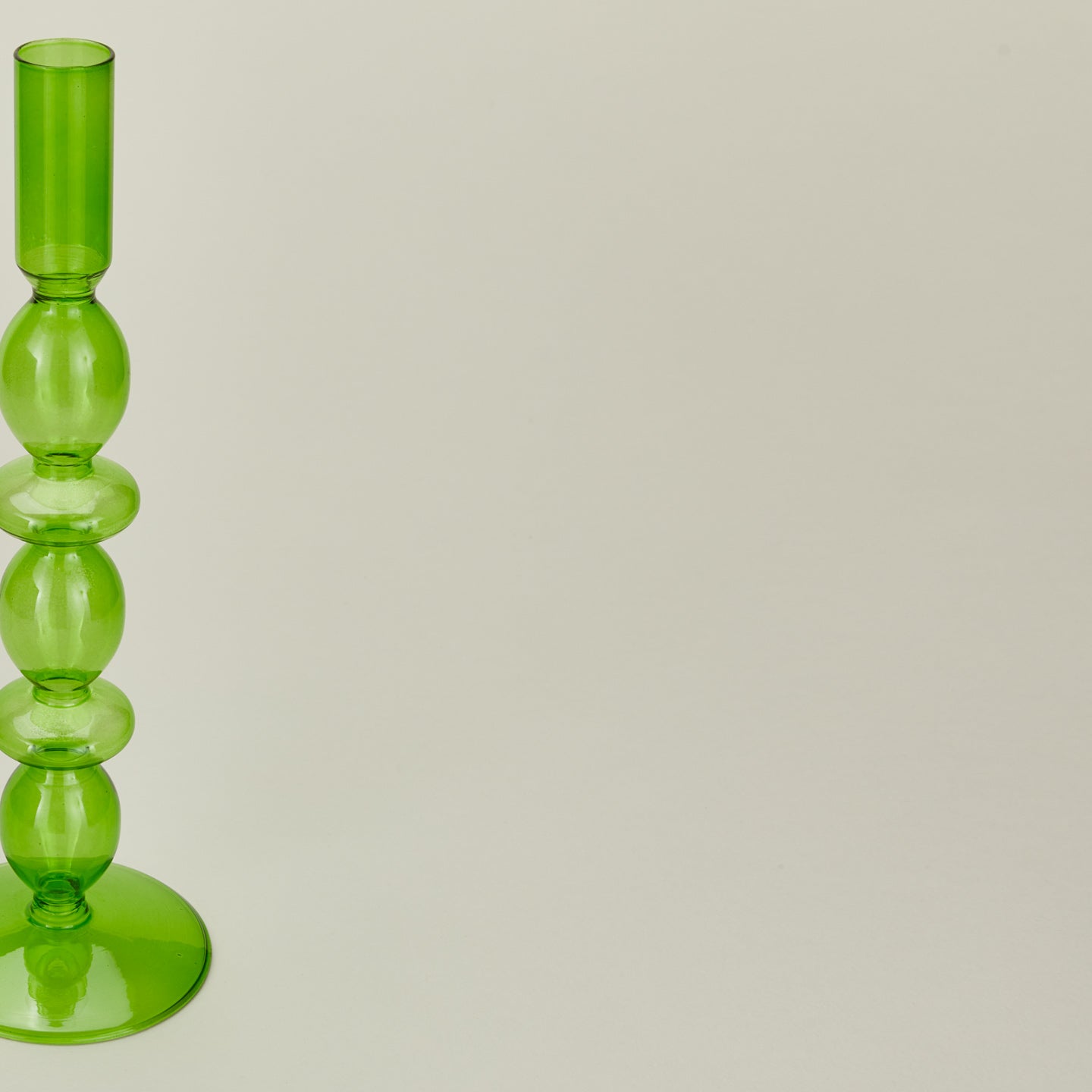 Close up view of Disk candle holder in green