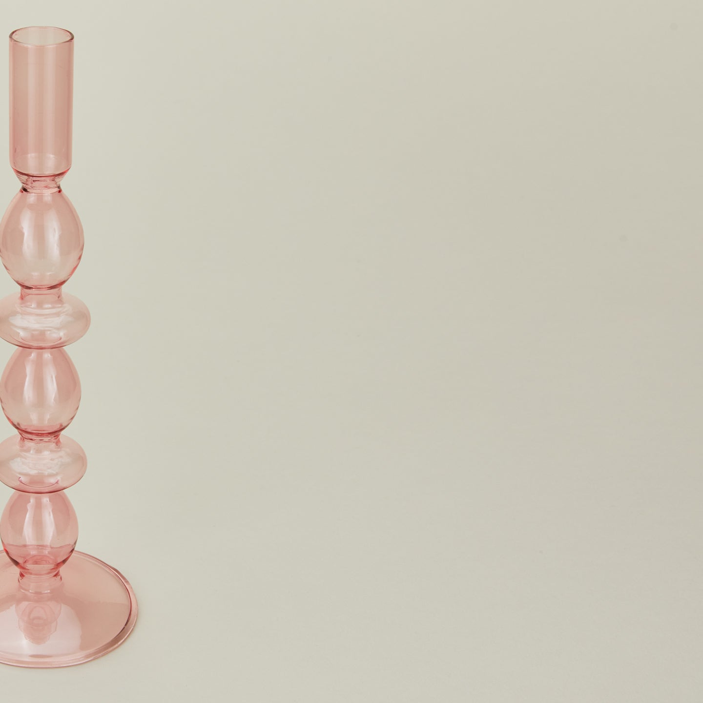 Close up view of Disk candle holder in pink