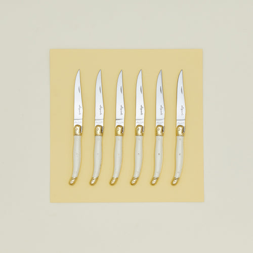 Jean Dubost steak knives set of 6 on yellow paper