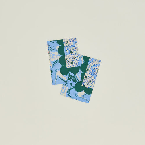 A set of two mixed floral napkins with a cornflower pattern.