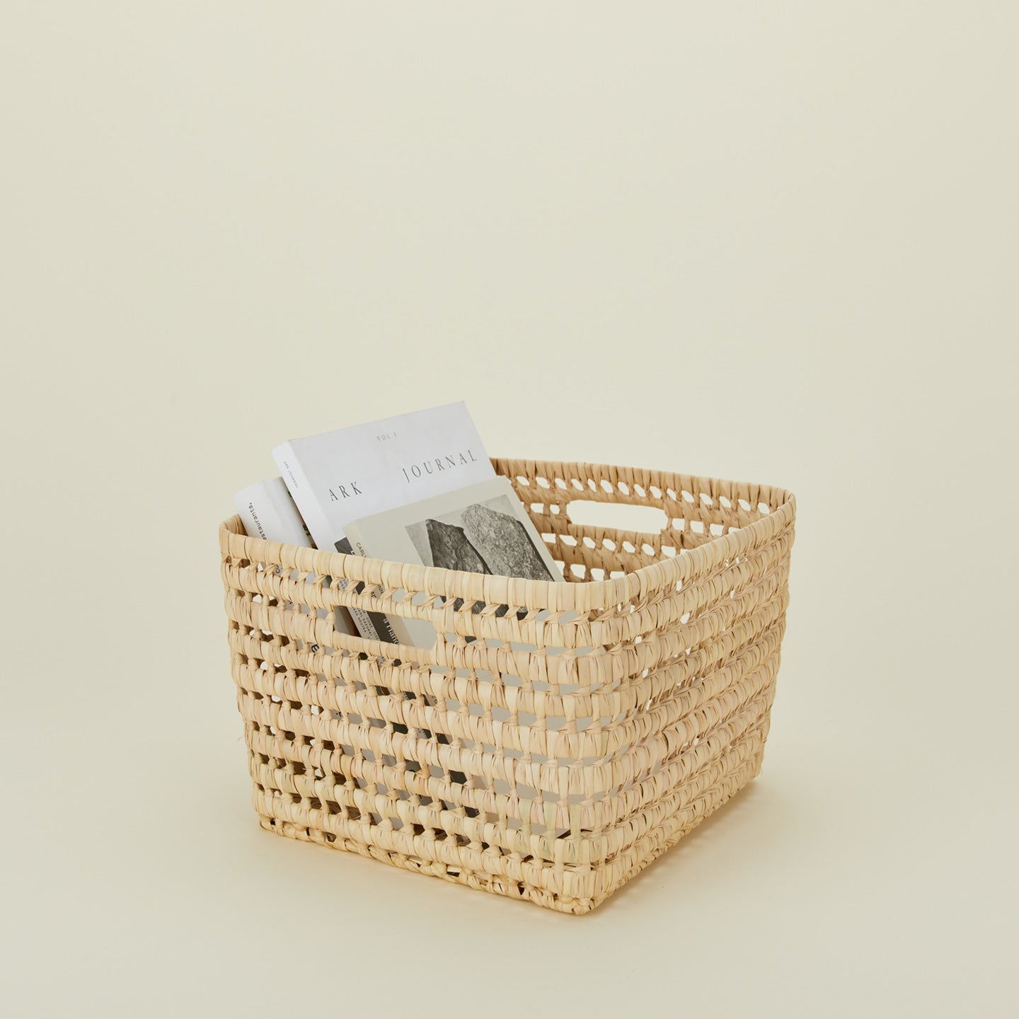 Medium open weave basket with books