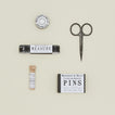 Sewing needles, scissors, pins and measuring tape