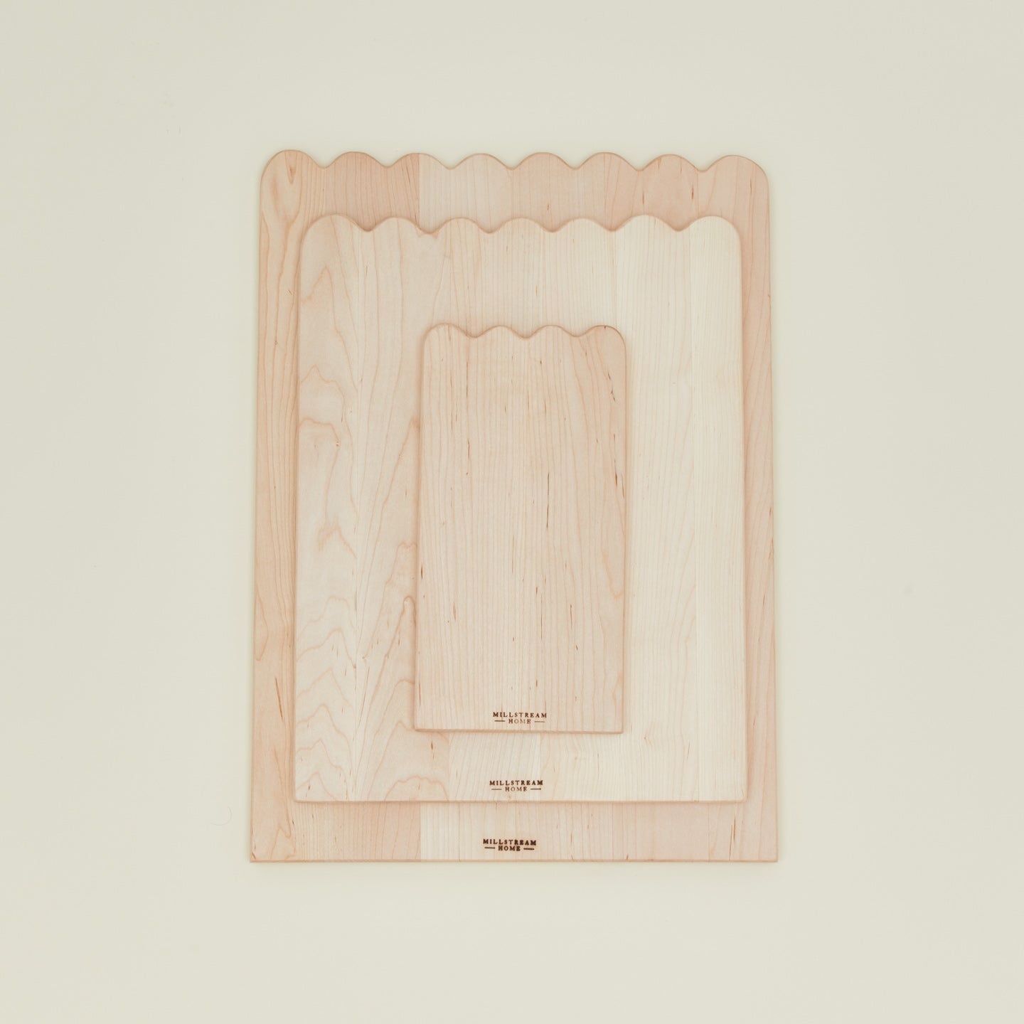 Overhead view of Scalloped cutting boards in all 3 sizes