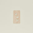 Overhead view of small scalloped cutting board with garlic