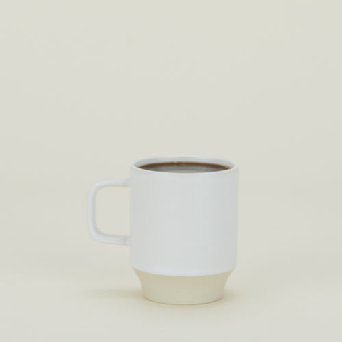 Modernist Mug filled with coffee.