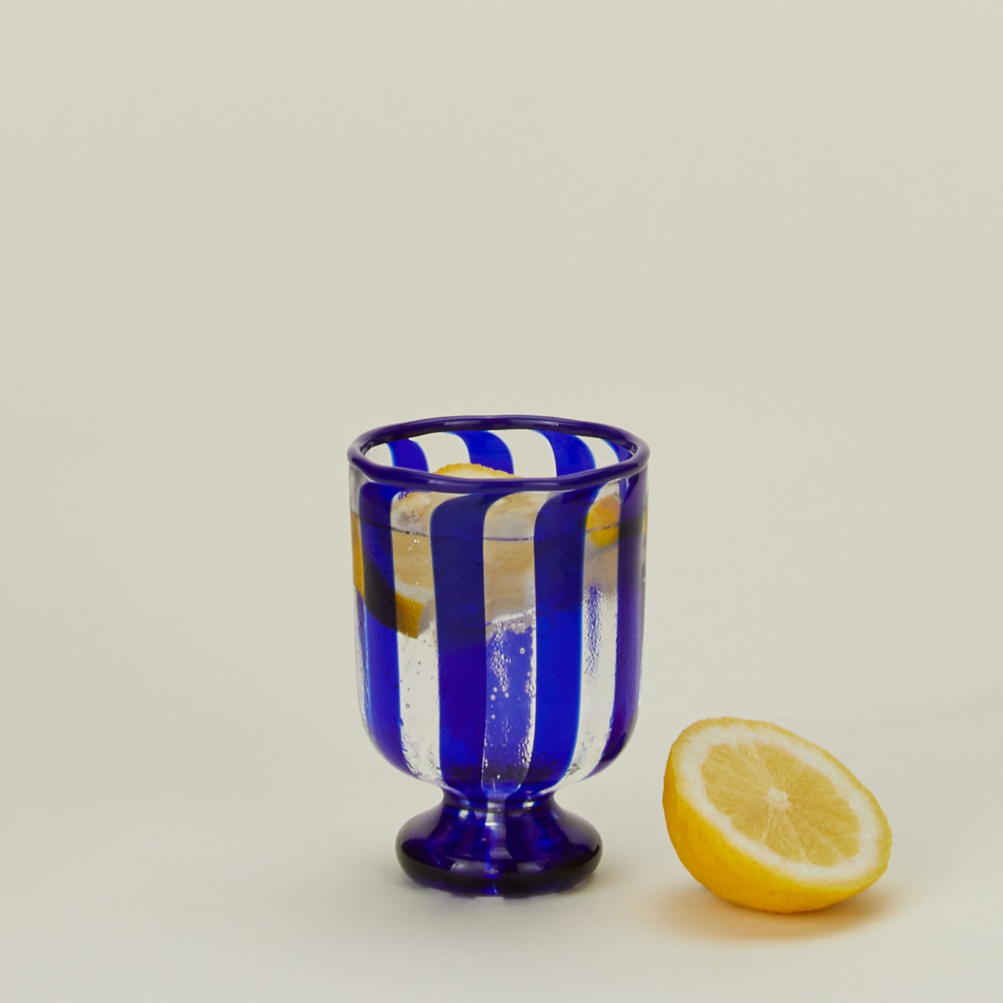 Blue striped wine glass with lemon