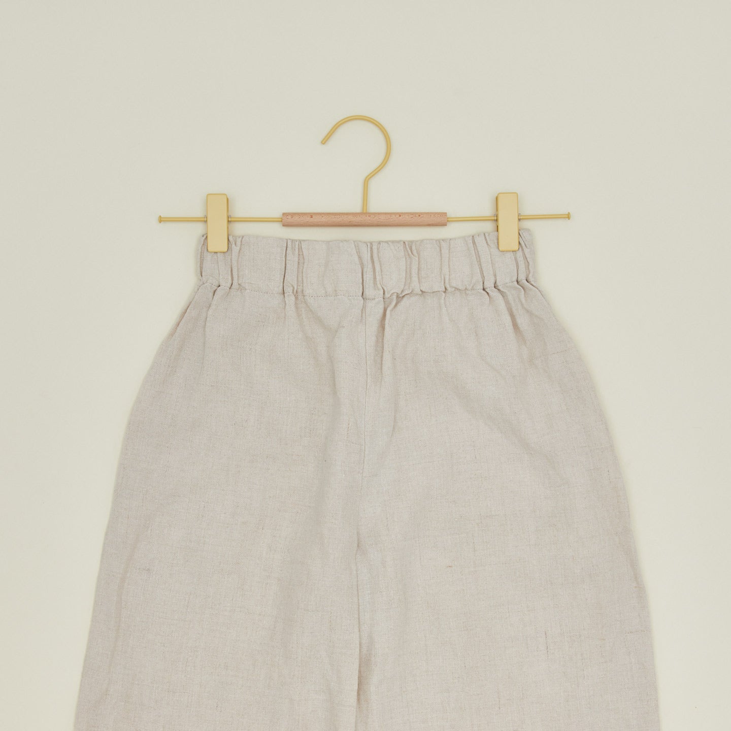 Clip hanger in butter with pants