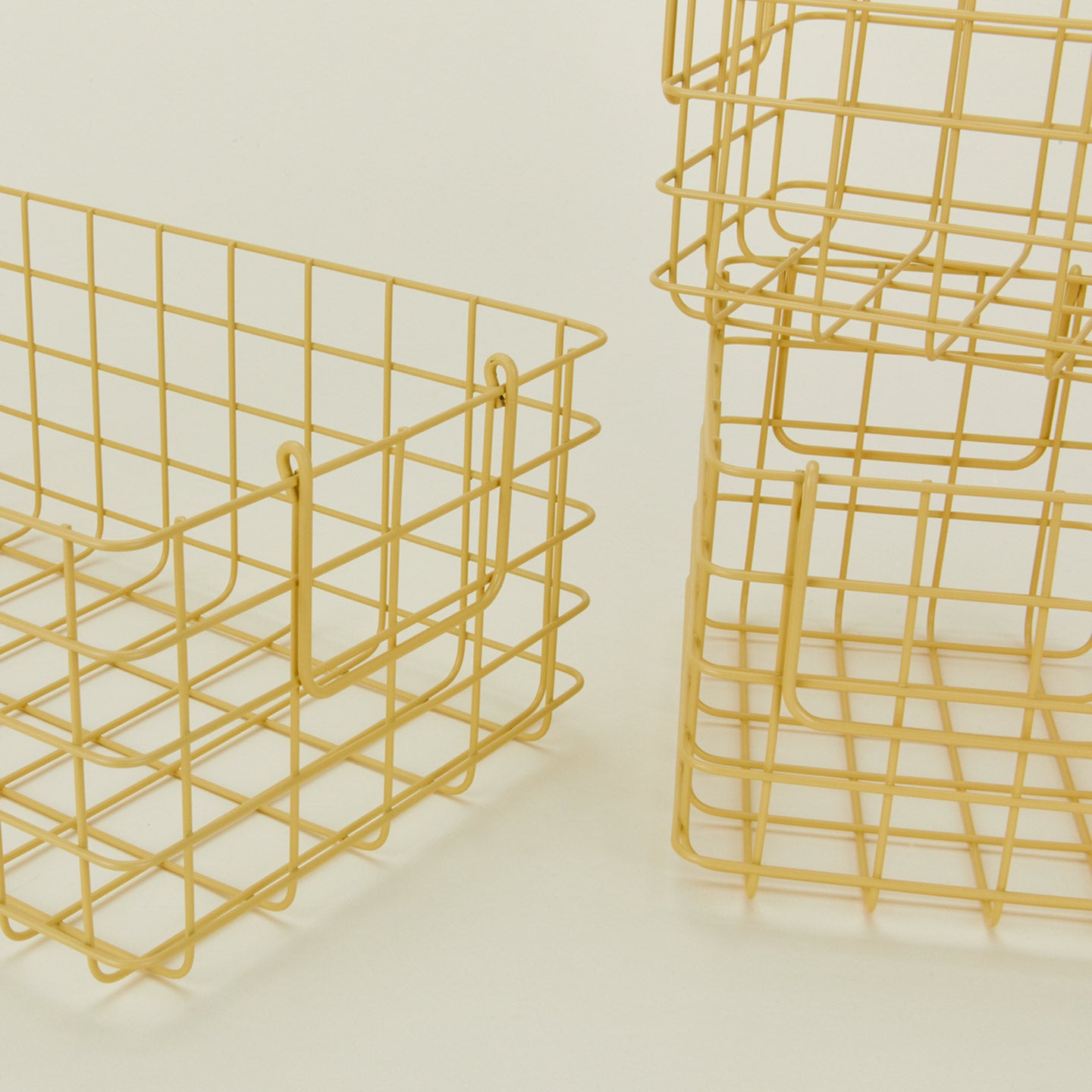 Close up view of Set of 3 grid baskets in butter
