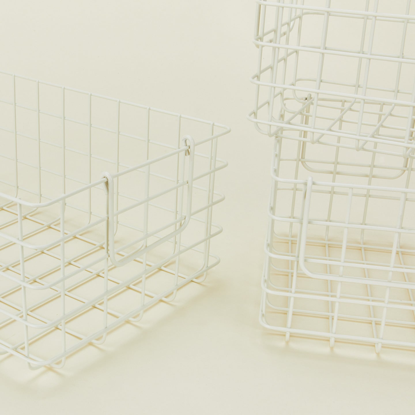 Close up view of Set of 3 grid baskets in chalk