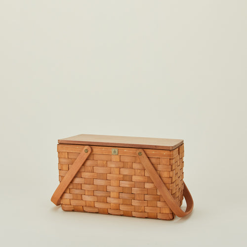 Picnic basket with lid closed and handles down