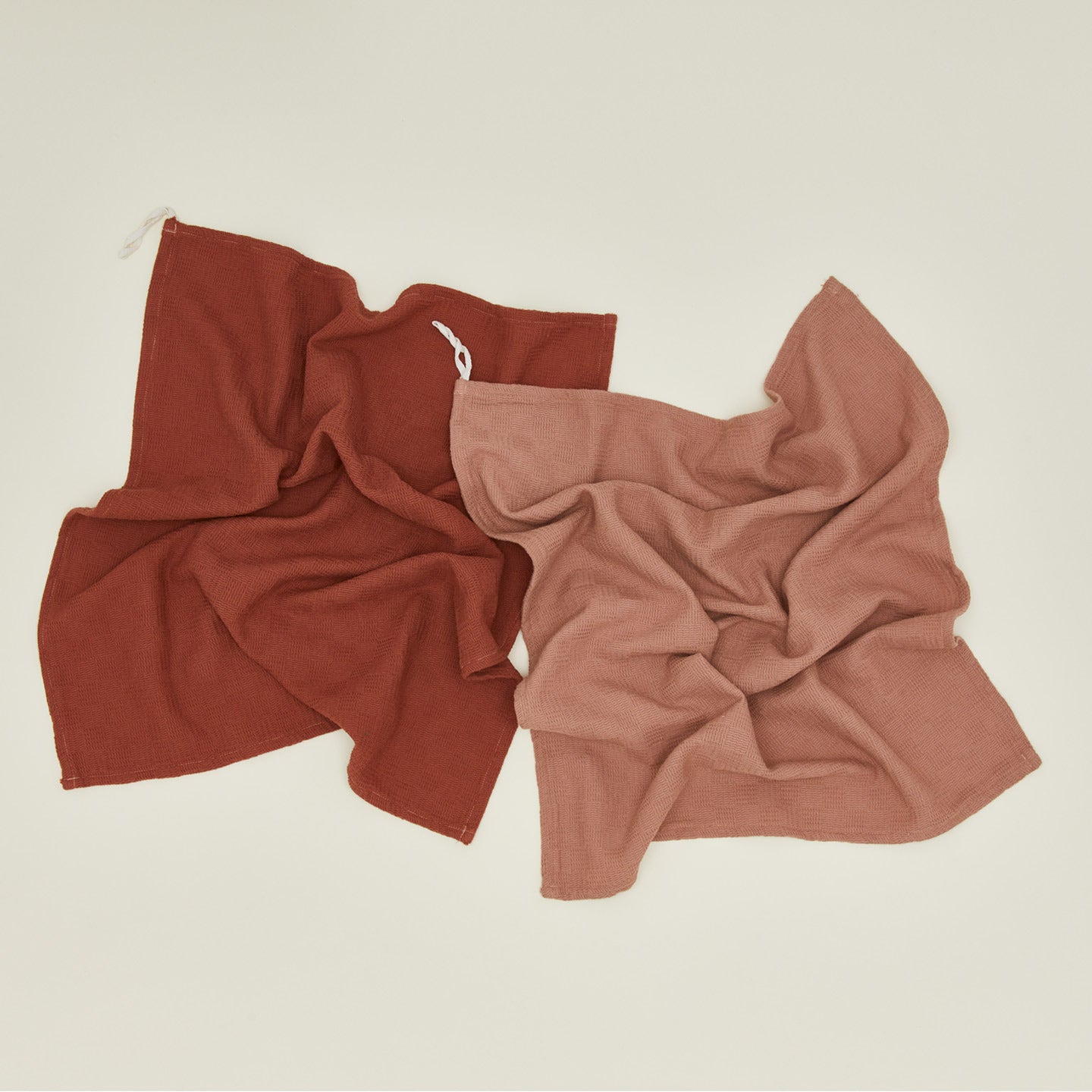 Woven stripe kitchen towels in blush and terracotta unfolded