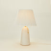 Pleat table lamp in bone with ivory shade