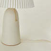 Close up view of Pleat table lamp in bone with ivory shade