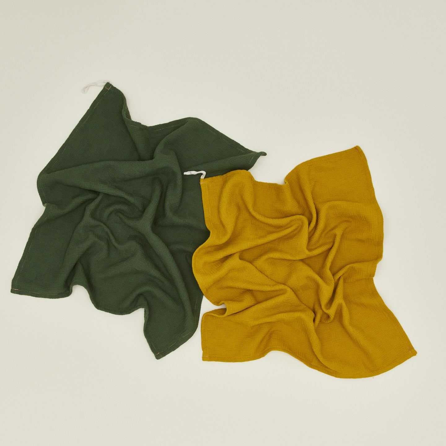 Woven stripe kitchen towels in mustard and olive unfolded