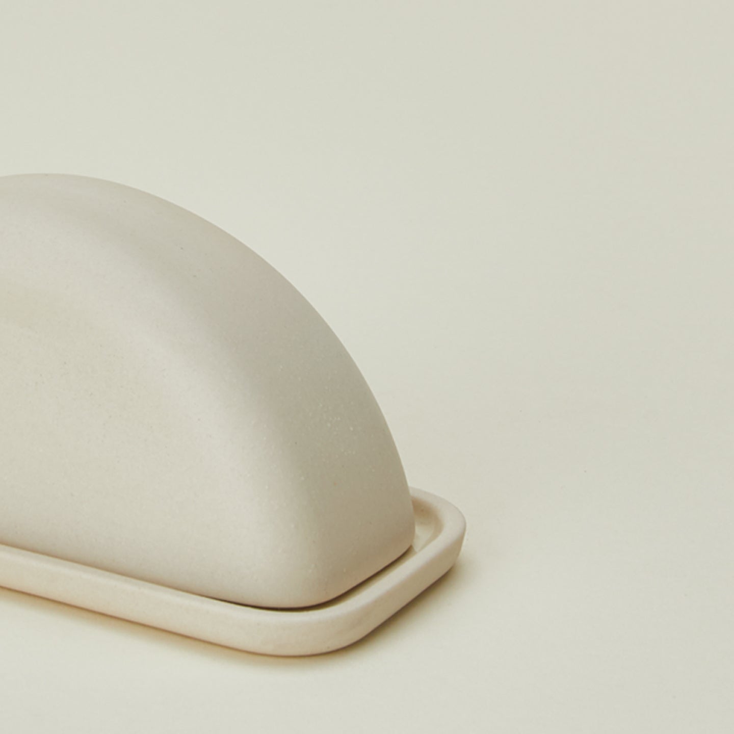 Close up view of Curve butter dish in natural