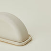 Close up view of Curve butter dish in natural