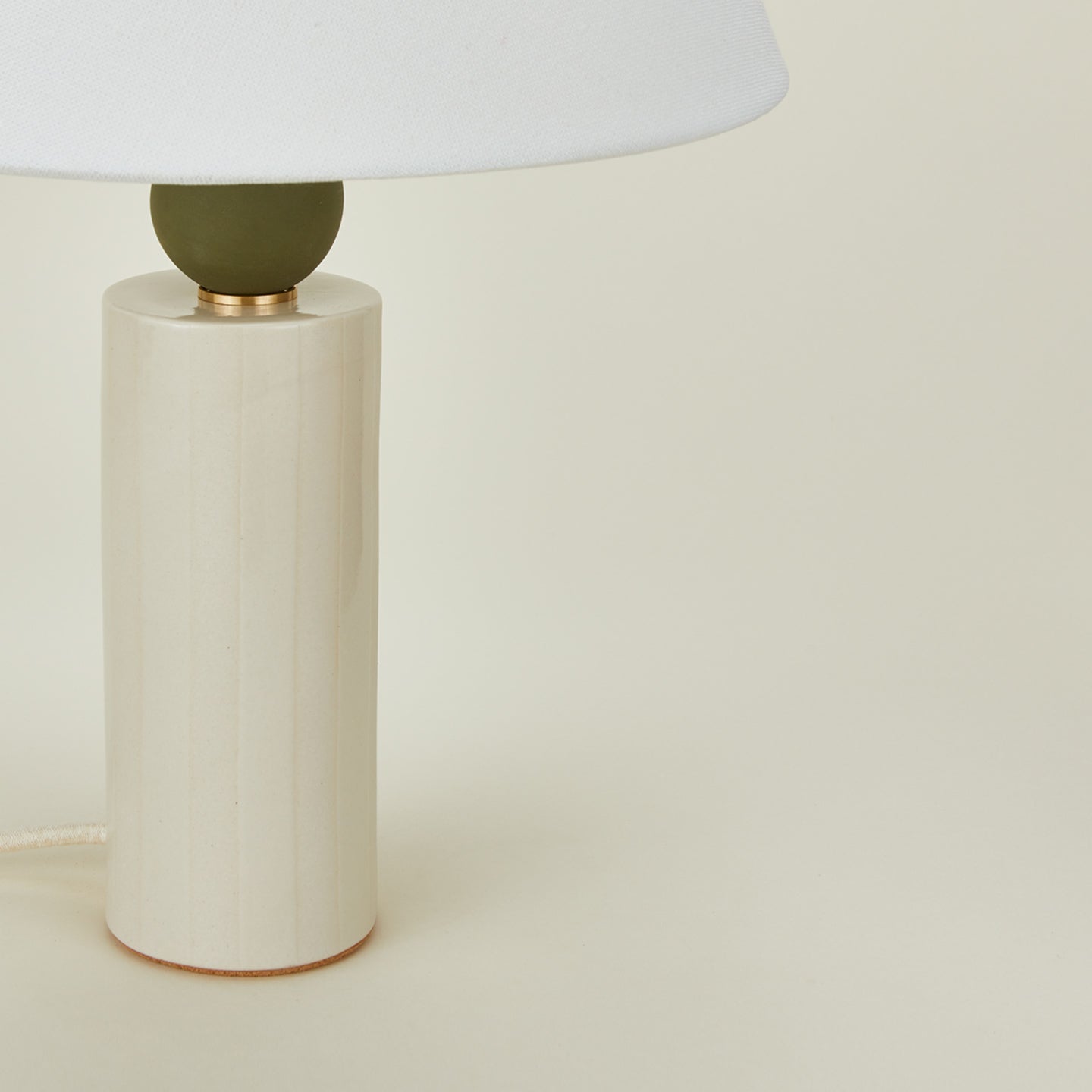 Close up view of Pillar table lamp in neutral stripe