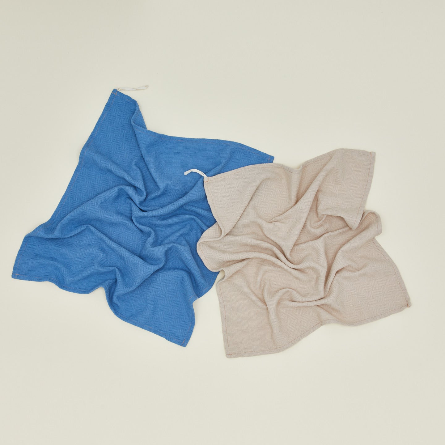 Woven stripe kitchen towels in sky and ivory unfolded