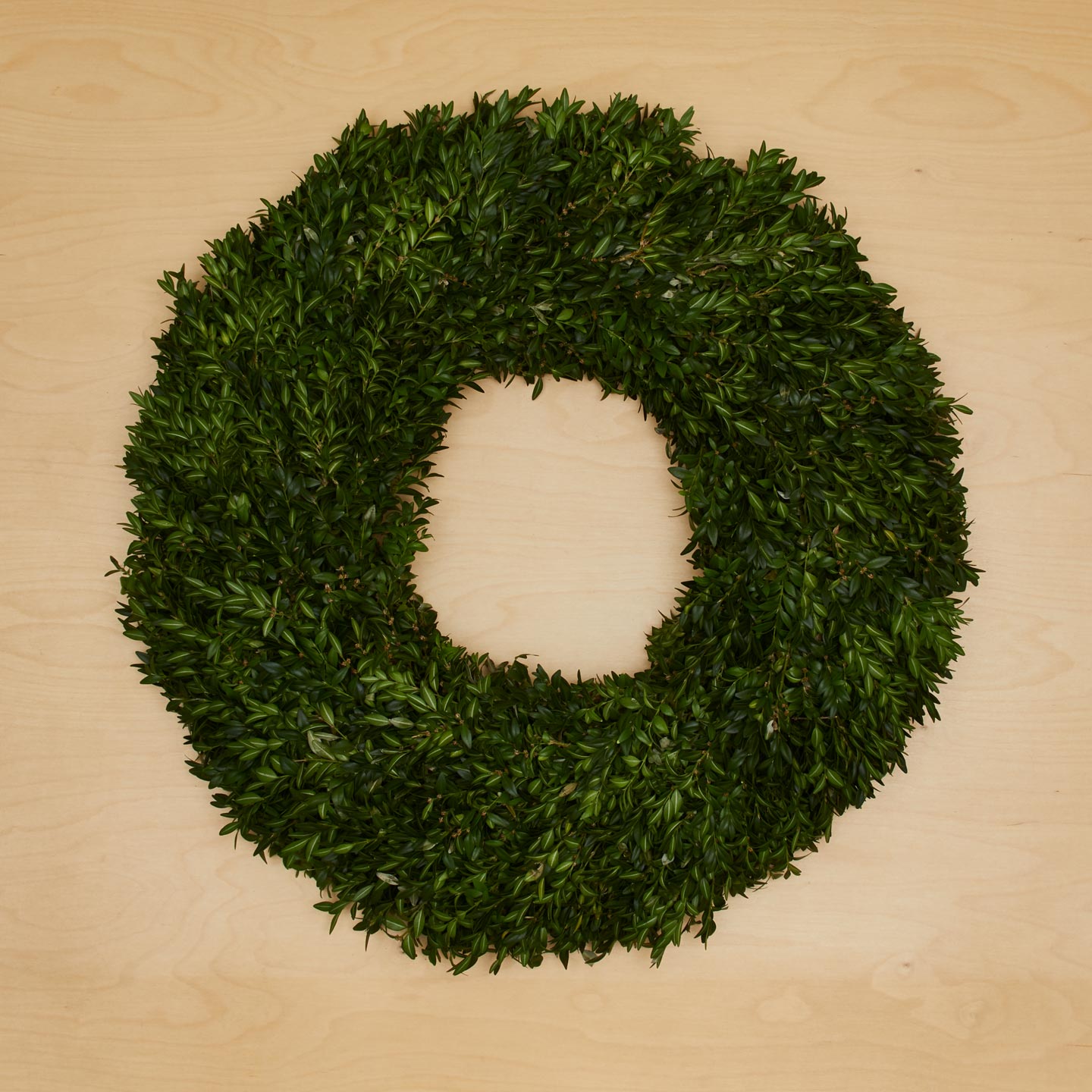 Boxwood Natural Wreath on wood background