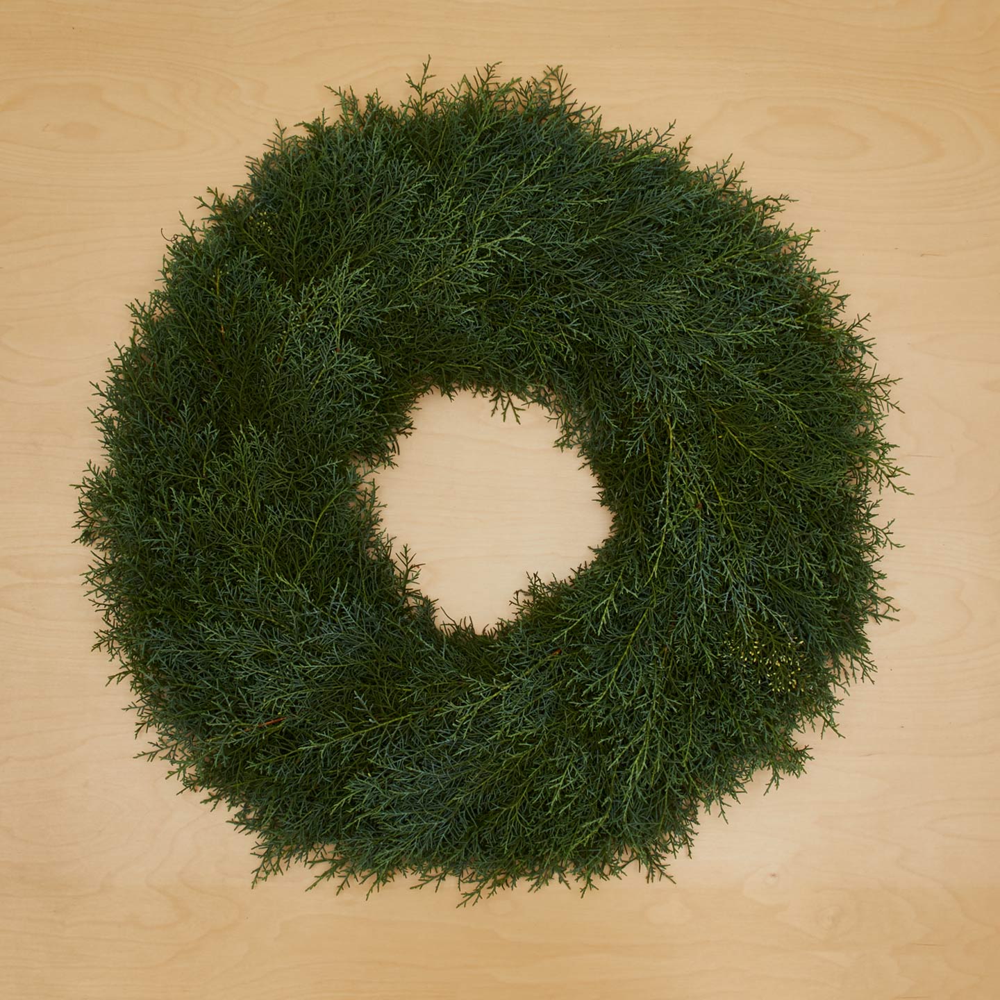 Juniper Natural Wreath on wood background