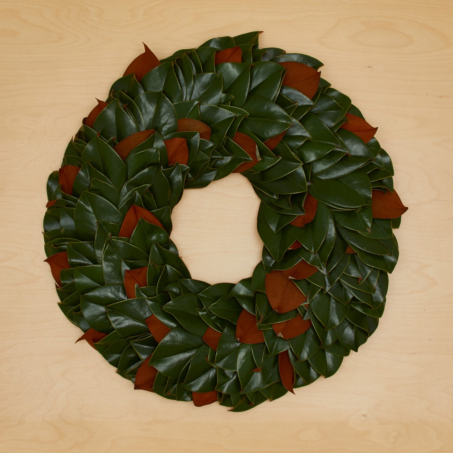 Magnolia Natural Wreath on wood background