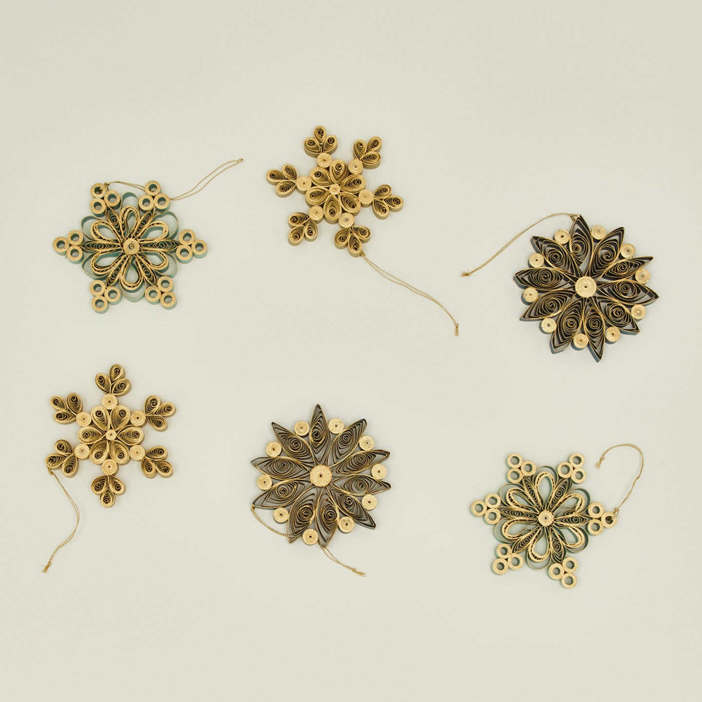 Quilled snowflake ornaments in cool