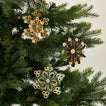 Quilled snowflake ornaments in cool on tree