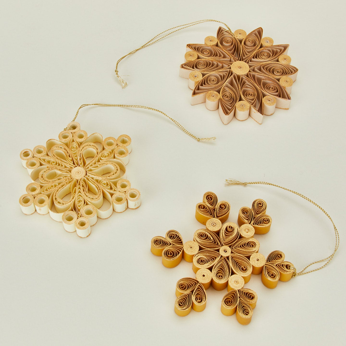 Quilled snowflake ornaments in neutral