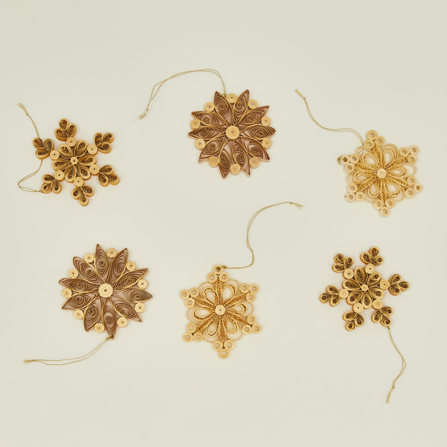 Quilled snowflake ornaments in neutral