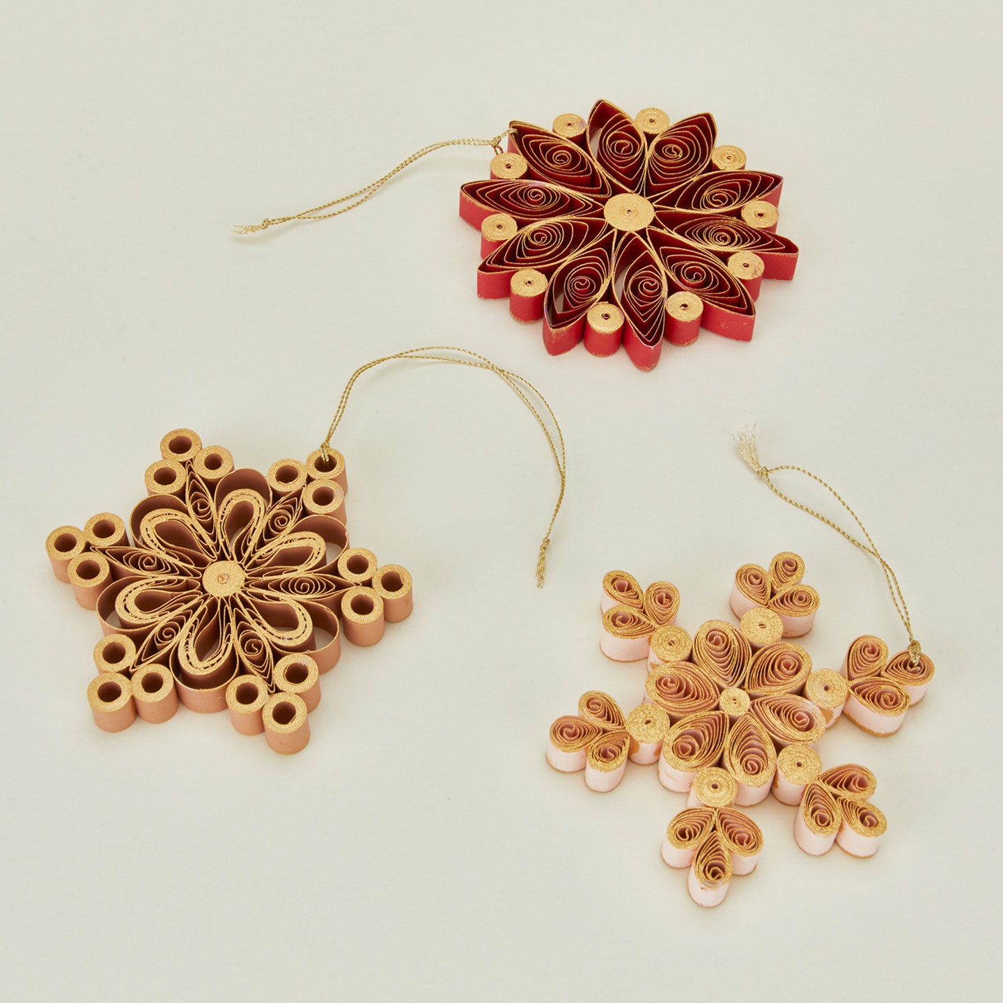 Quilled snowflake ornaments in warm